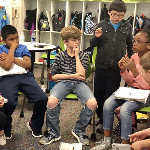  group of kids discussing something